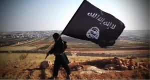 Figure 3: ISIS fighter with Islamic State flag (redstate.com)